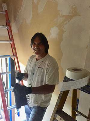 A man restoring the historic San Jose Woman's Club house