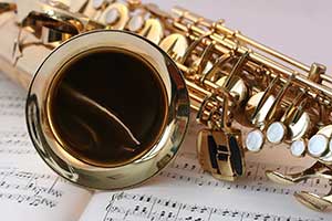 Image of a saxophone on sheet music